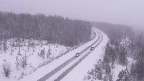 Flight above frozen road and forest in Yakutiya 動画素材 123778257