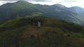 The flight above the greeting people on the mountain 4k or 4k+ Resolution