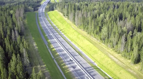 Flight Above Highway in Forest Stock Footage 66779718