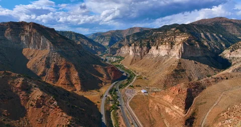 Flight above the highways passing between the bare canyons. Stock Footage 317816825