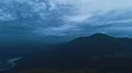 The flight above a man with a firework stick on the mountain 4k or 4k+ Resolution