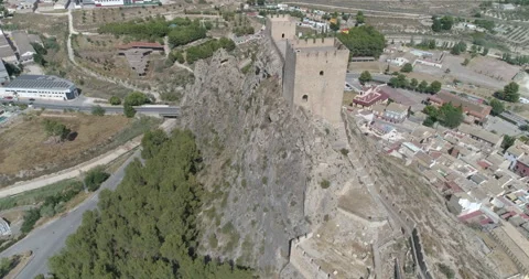 Flight above medieval castle over rocky mountain Stock Footage 209999147