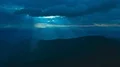 The flight above the mountain on a blue clouds background. Hyperlapse 4k or 4k+ Resolution