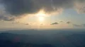 The flight above the mountain on the bright sun background. Hyperlapse 4k or 4k+ Resolution