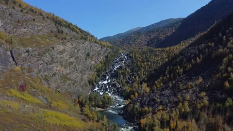 Flight above the mountain river among dense forest. Bird's eye view Stock Footage 142418883