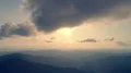 The flight above a mountain on the sunny background. Hyperlapse 4k or 4k+ Resolution