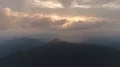 The flight above a mountain on the sunset background. Hyperlapse 4k or 4k+ Resolution