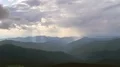 The flight above mountains against the beautiful cloud stream. Hyperlapse 4k or 4k+ Resolution