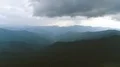 The flight above mountains on a beautiful cloud stream background. Hyperlapse 4k or 4k+ Resolution