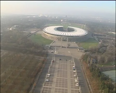 Flight above Olympic stadium, very low altitude, from gate to bell tower Stock Footage 44138015