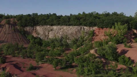Flight above the red sand old iron mine Stock Footage