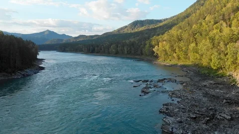 Flight above riverbed and mountain valley in summer day. Stock Footage 112487352