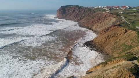 Flight above Rock and Ocean Waves Stock Footage 89977062