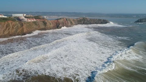 Flight above Rock and Ocean Waves Stock Footage 89977632