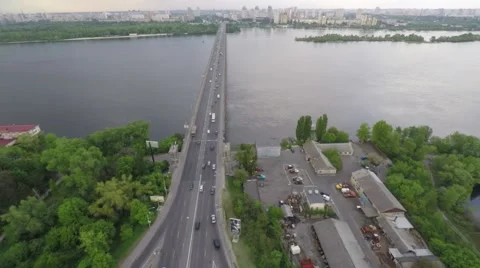 Flight above the round road junction and bridge. Stock Footage 64378095