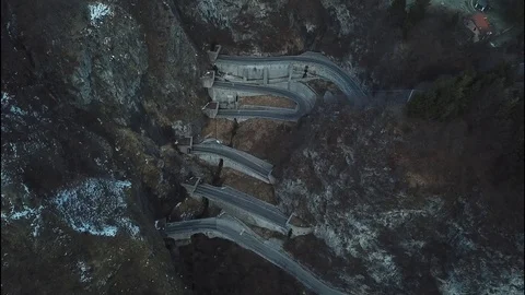 Flight above San Boldo pass serpentine road in Italy Stock Footage 113825938