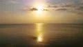 The flight above the sea on the dawn background. quadrocopter shot 4k or 4k+ Resolution