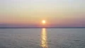 The flight above the sea on the sunrise background. drone shot 4k or 4k+ Resolution