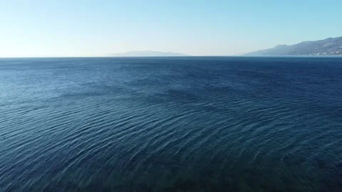 Flight above the sea surface and beach 스톡 동영상 150116882