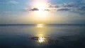 The flight above the sea surface on the bright sun background. quadrocopter shot 4k or 4k+ Resolution