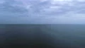The flight above the sea surface on the picturesque cloud stream background 4k or 4k+ Resolution