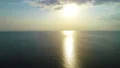 The flight above the sea surface on the sunset background. quadrocopter shot 4k or 4k+ Resolution