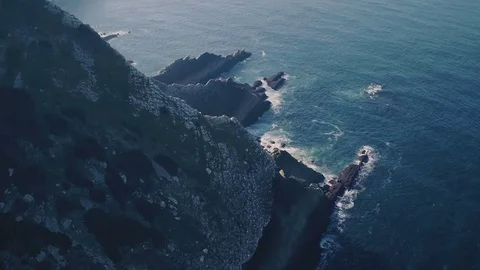 Flight Above Sharp Cliff in Ocean Stock Footage 72313024