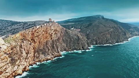 Flight Above Sharp Cliff in Ocean Stock Footage 148748887