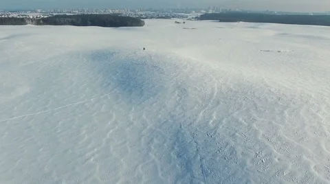 Flight above snow fields in winter, aerial panoramic view. 動画素材 67759090