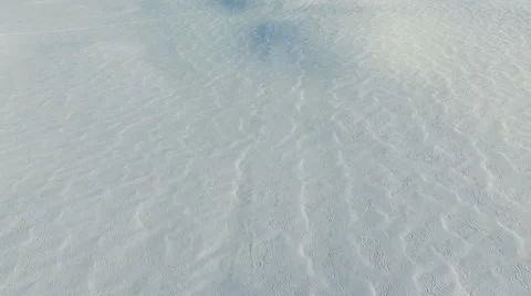 Flight above snow fields in winter, aerial panoramic view. Video stock 67759143