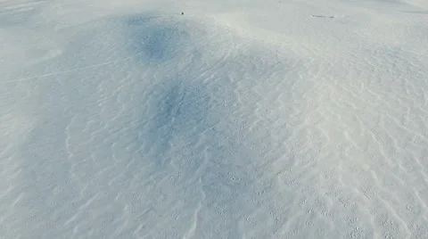 Flight above snow fields in winter, aerial panoramic view. Video stock 67759171