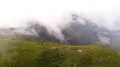The flight above the tent camp with people on the beautiful mountain 4k or 4k+ Resolution