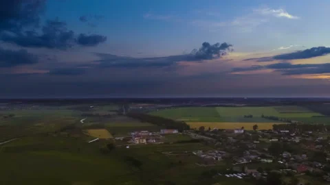 The flight above the town on a sunset background. quadrocopter shot, time lapse Stock Footage 92154707