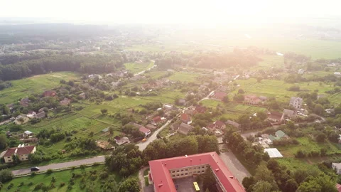 The flight above a town on the sunset background. quadrocopter shot, time lapse Video stock 92869889