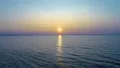 The flight above the water on the picturesque sunrise background. drone shot 4k or 4k+ Resolution