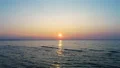 The flight above the water on the sunset background. drone shot 4k or 4k+ Resolution
