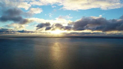 The flight above the water on the sunset background. time lapse Stock Footage 97277715