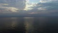 The flight above the water surface on the sunrise background. quadrocopter shot 4k or 4k+ Resolution