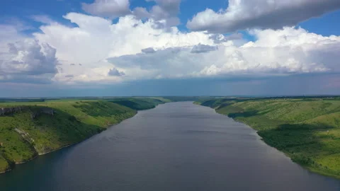 Flight above wide river between green mountains Stock Footage 160222782