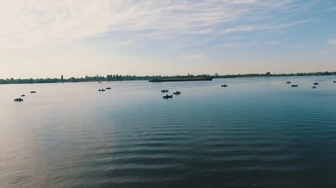 Flight of the air chamber over several fishing vessels installed on the river. Stock Footage 90175459