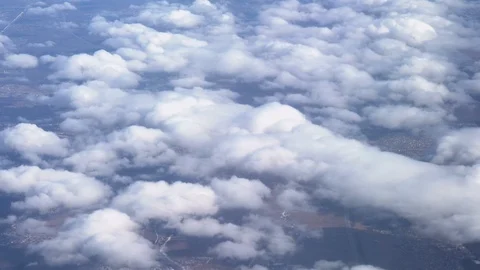 Flight on an airplane above thick clouds. Top view from the porthole Stock Footage 106541475