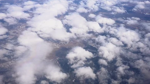Flight on an airplane above thick clouds. Top view from the porthole Stock Footage 106541599