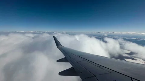 Flight on an airplane. Wing of an airplane in the clouds. View from aircraft Stock Footage 88259962