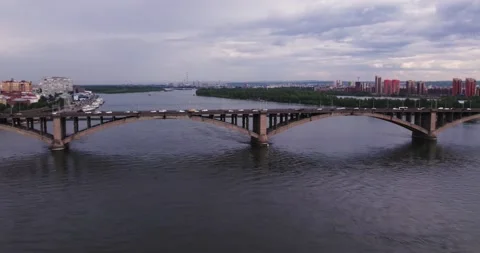 Flight along a bridge crossing a wide river Stock Footage 171073006