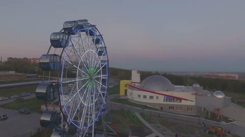 Flight along the ferris wheel at the evening Stock Footage 55076456