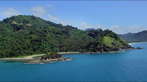 Flight along a forest covered hilly coast line Video stock 25363015