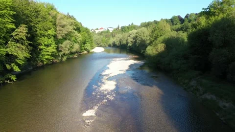 Flight along german Isar river in spring near Alps and Munich. Video stock 131822692