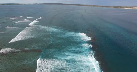 Flight along a line of swells  breaking at Surf Point, Shark Bay Video stock 92843737