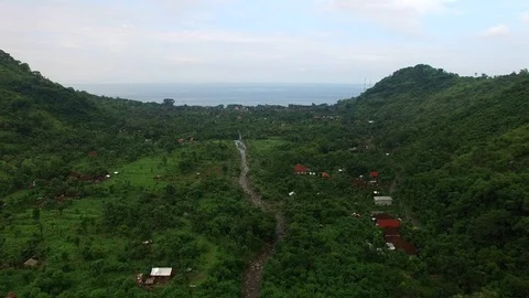 Flight along mountains covered with rainforest Stock Footage 108677105