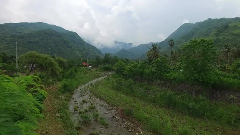 Flight along mountains covered with rainforest Video stock 108679681
